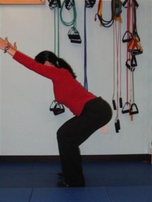 For double leg squats, place feet shoulder width apart and arms extended out in front of you for balance. Squat halfway down and hold this position for a moment.