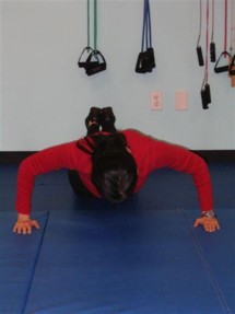 Perform a typical push-up with your elbows pointing out to the sides to work chest muscles.